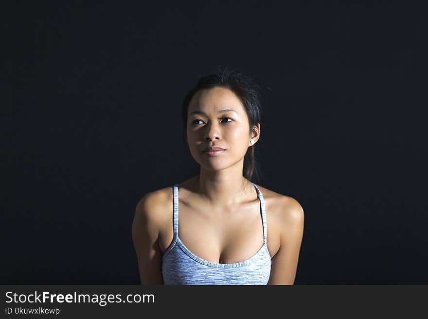 Woman in Gray Spaghetti Strap Top