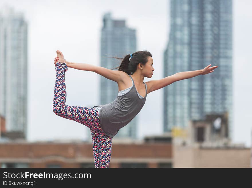 Selective Focus Photography of Woman Doing Yoga