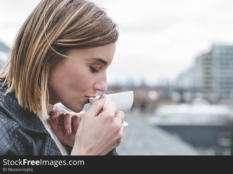 Woman Drinking on Teacup