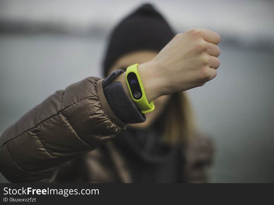 Person Wearing Green Xiaomi Band