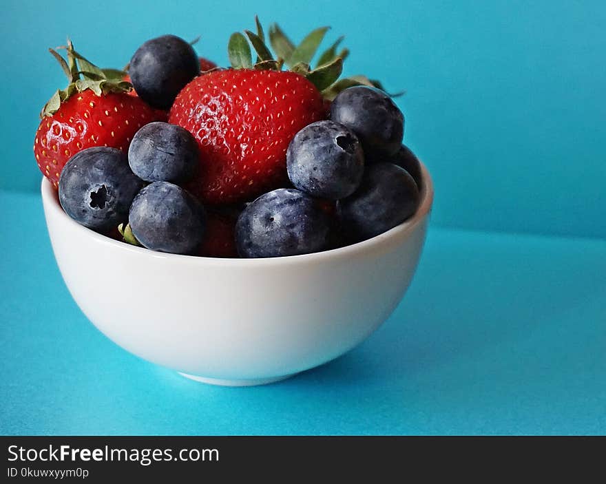 Blueberries and Strawberries in White Ceramic Bowl