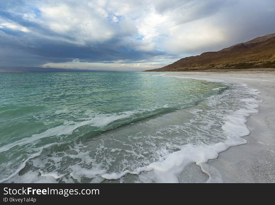 Landscape Photography of Seashore Near Mountains