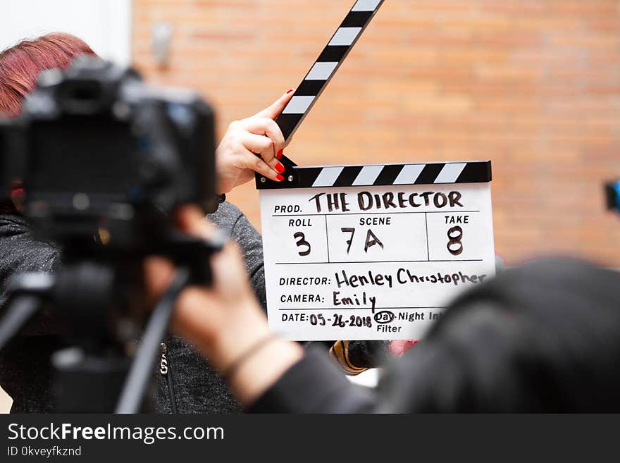 Man Holding Clapper Board