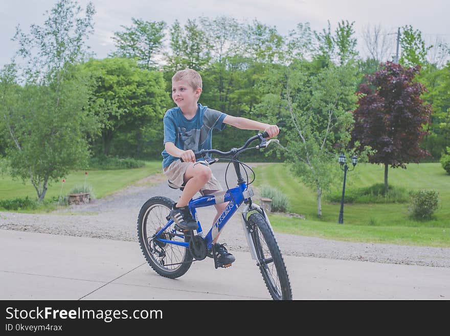 Boy Riding Bicycle