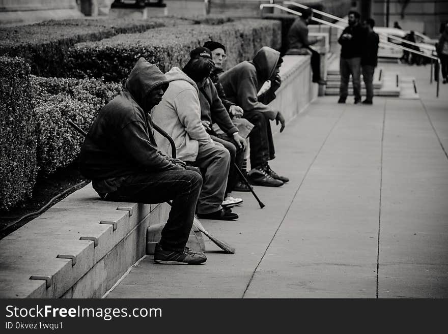 People Sitting Near the Garden