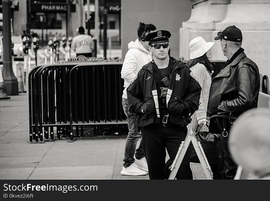 Man Wearing Jacket and Peaked Cap Grayscale Photo