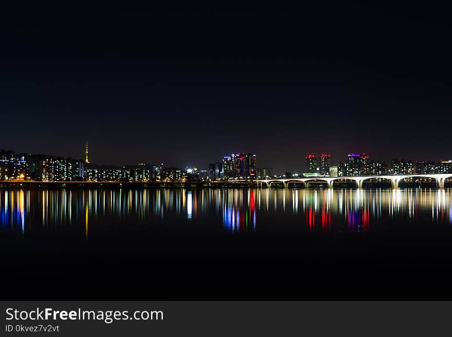 City Near Bodies of Water during Night Time