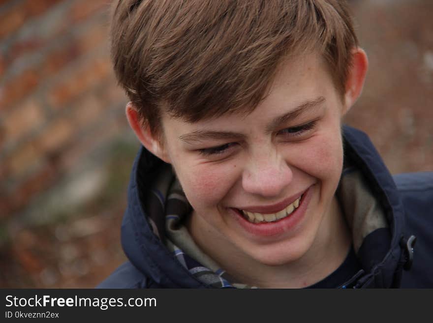 Smiling Man in Black Hooded Jacket