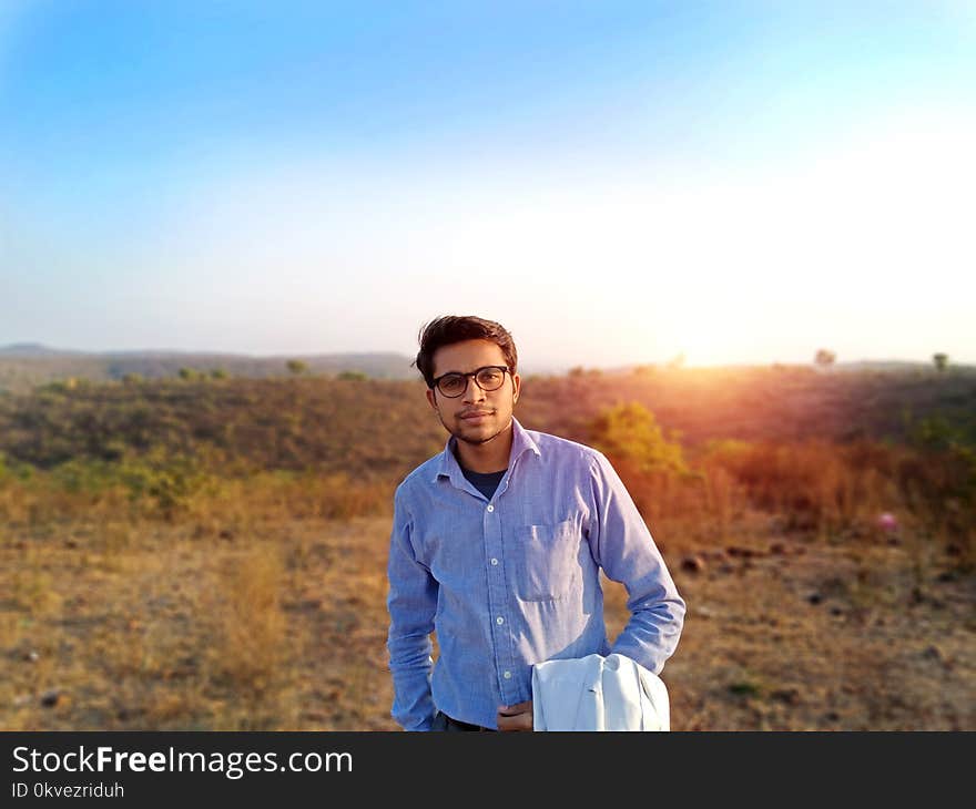 Man Wearing Blue Sport Shirt