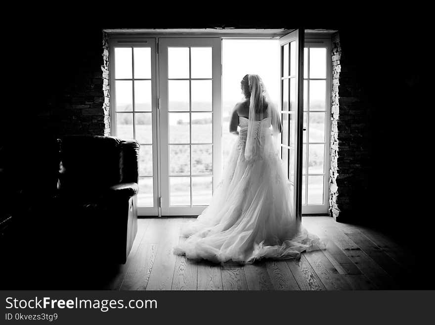 Grayscaled Photography of Woman Wearing Wedding Dress