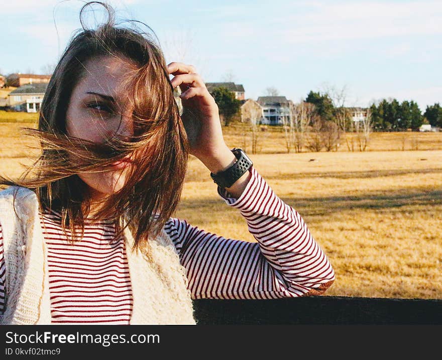 Woman About to Hold Her Hair during Daytiome