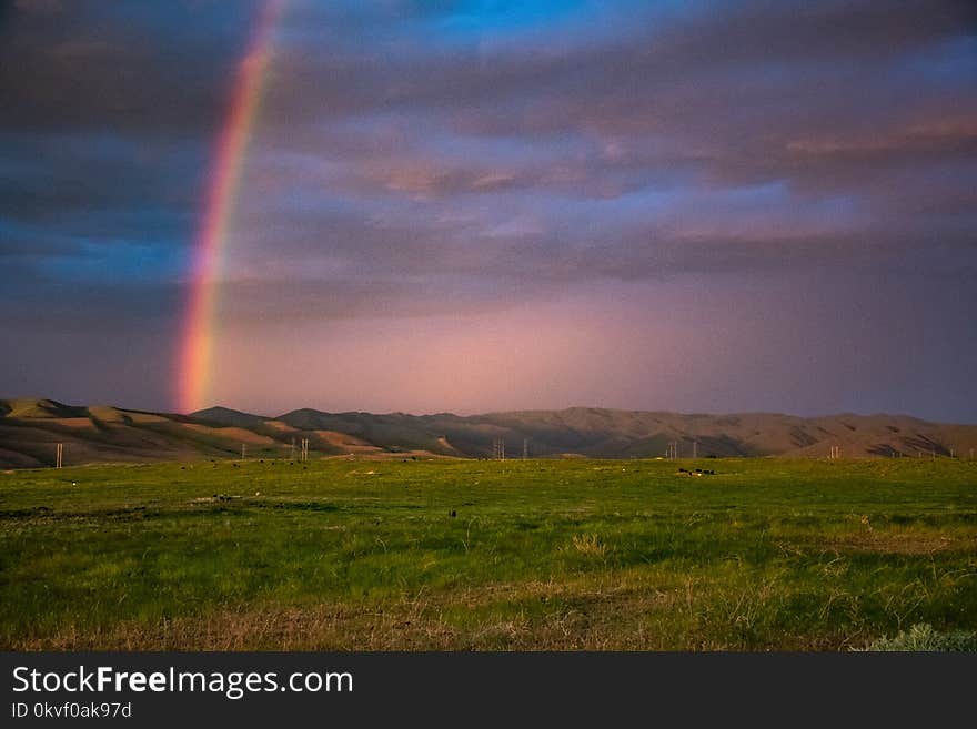 Landscape Photography of Mountains With Rainbow