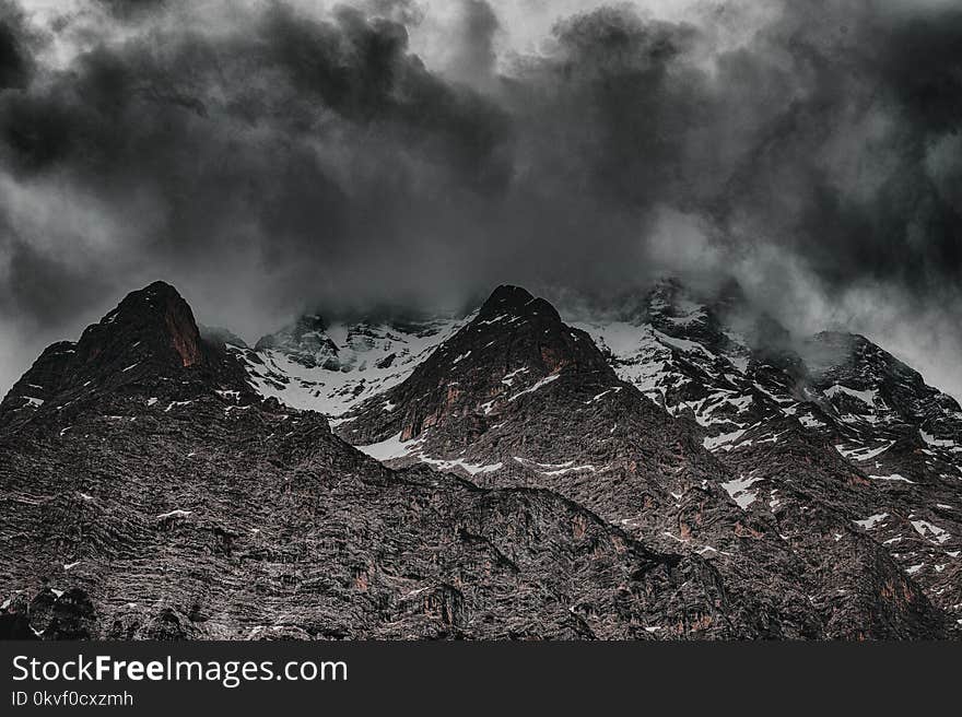 Grayscale Photo of Mountain Hill