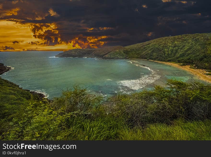 Landscape Photography of Body of Water Under Gray and Orange Sky