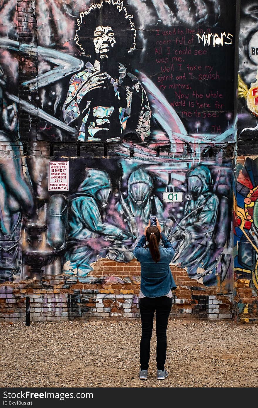 Photography of a Woman Taking Picture