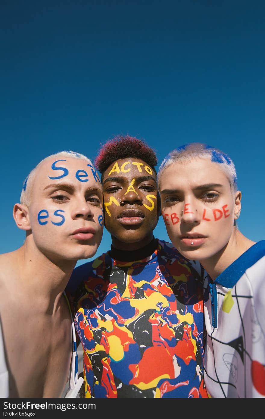 Three People With Face Paints