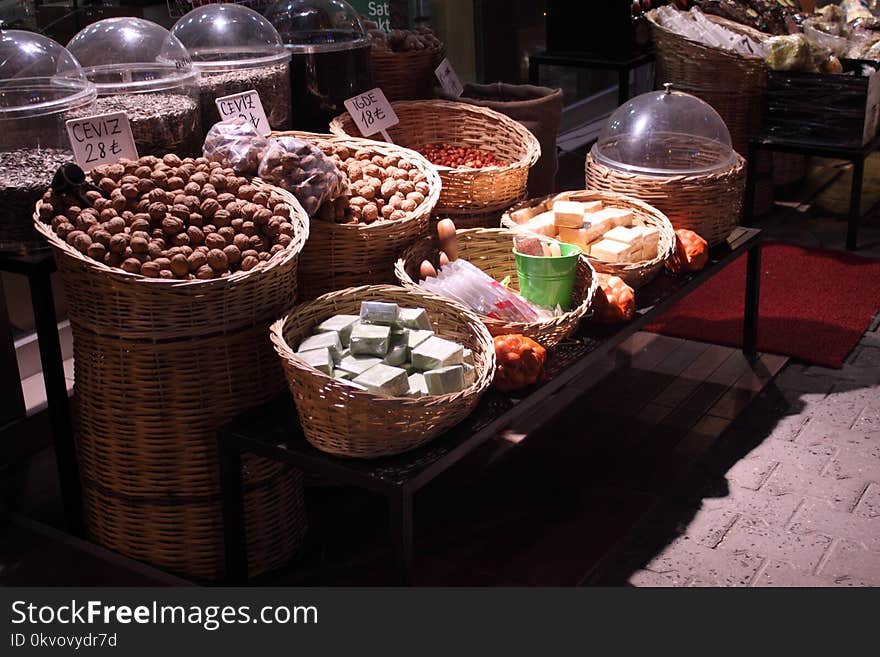 A kind of natural market, placed in mesh baskets ,various soaps, nuts and dried plants. walnut, olive oil soap, sunflower seeds, spruce