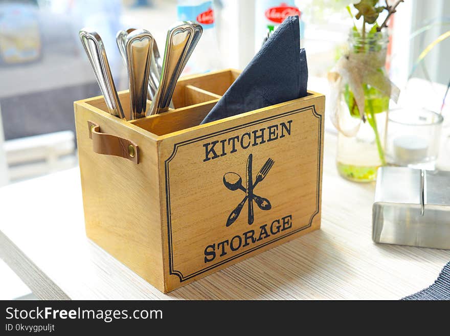 Closeup Photo of Brown Wooden Box With Flatware Set