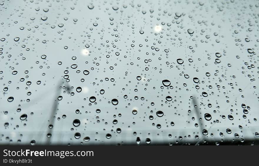 Closeup Photo of Dew Drops on Glass