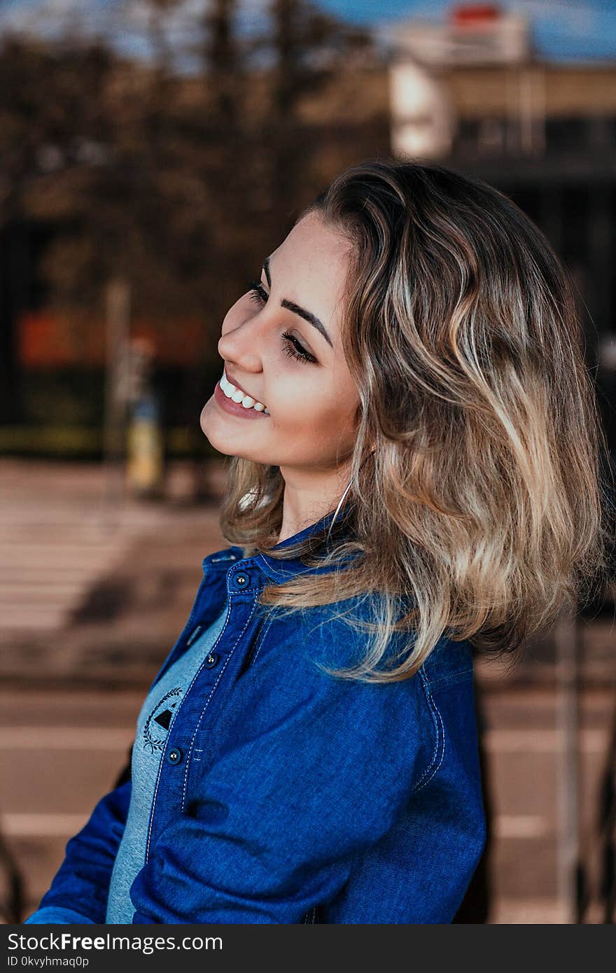 Woman Wearing Blue Denim Jacket