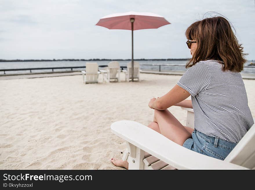 Woman sitting on beach chair