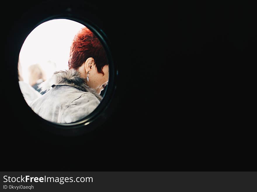 Person With Red Hair Wearing Gray Parka