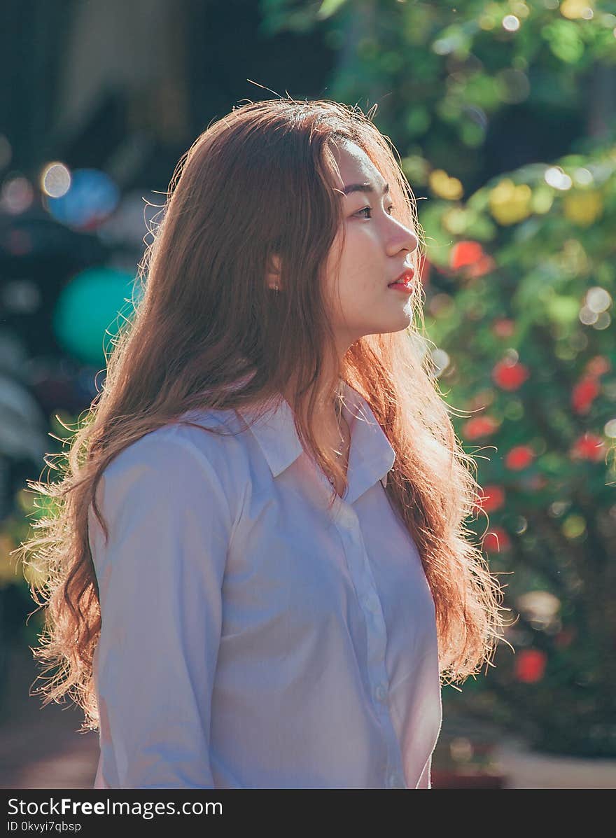 Woman in White Collared Button-up Long-sleeved Shirt