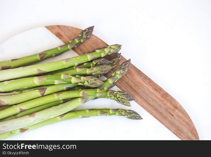 Green Stems on Brown and White Surface