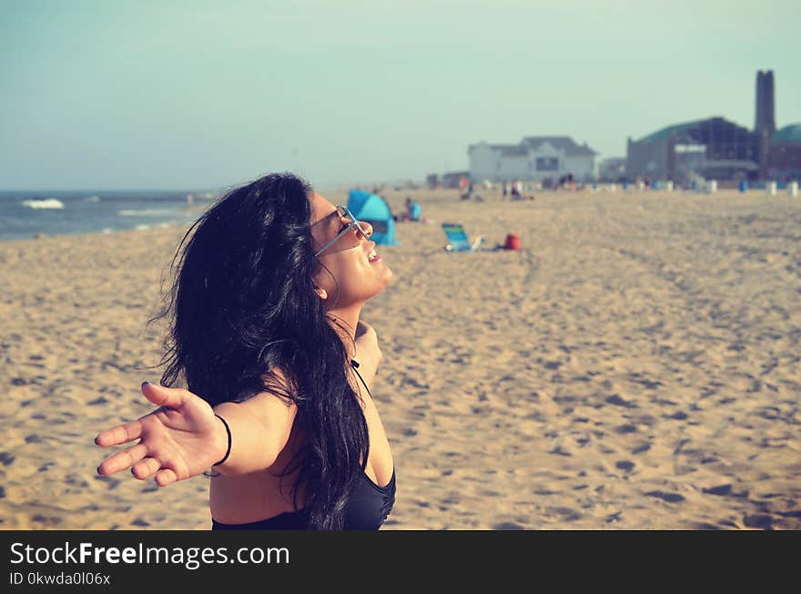 Woman in Black Bra at Beach