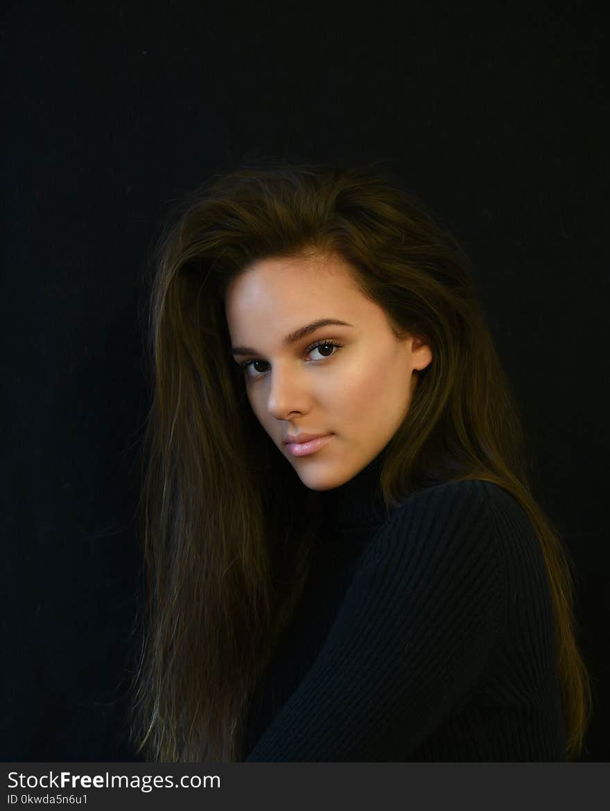 Brown Haired Woman in Black Top