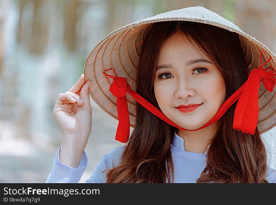 Woman Wearing Conical Hat and Gray Shirt