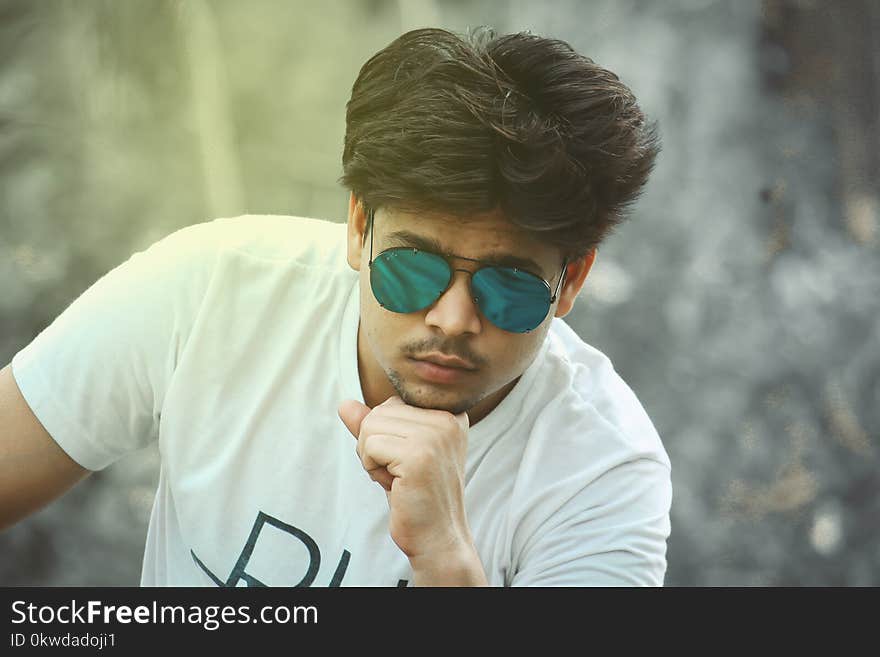 Man Wearing Blue Sunglasses With Black Frame