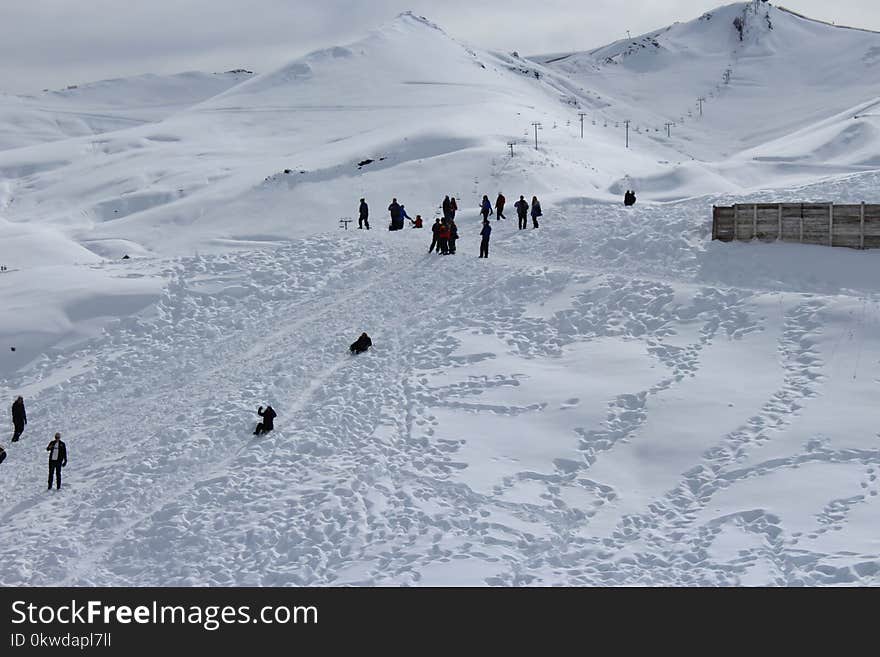 Person Walking on Snowfield