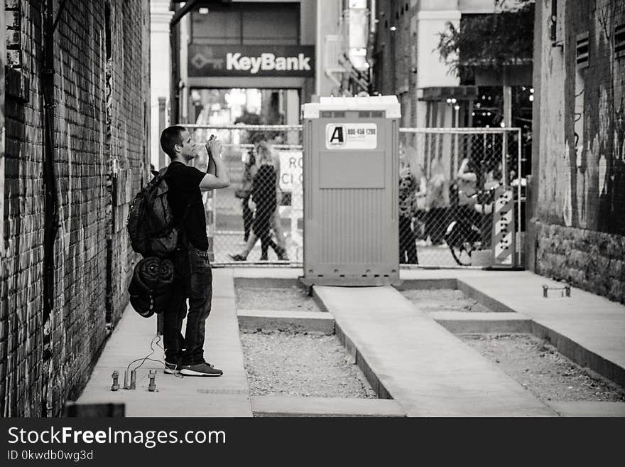 Man Standing Near Keybank Signage