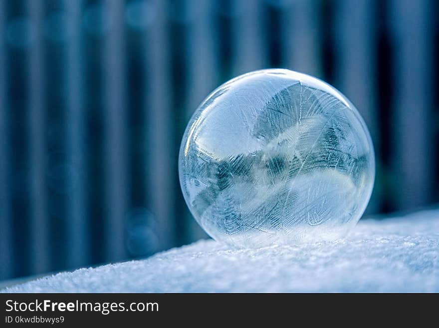 Glass Ball on White Surface