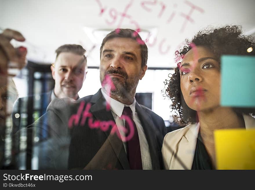 Two Men And One Woman In A Photo