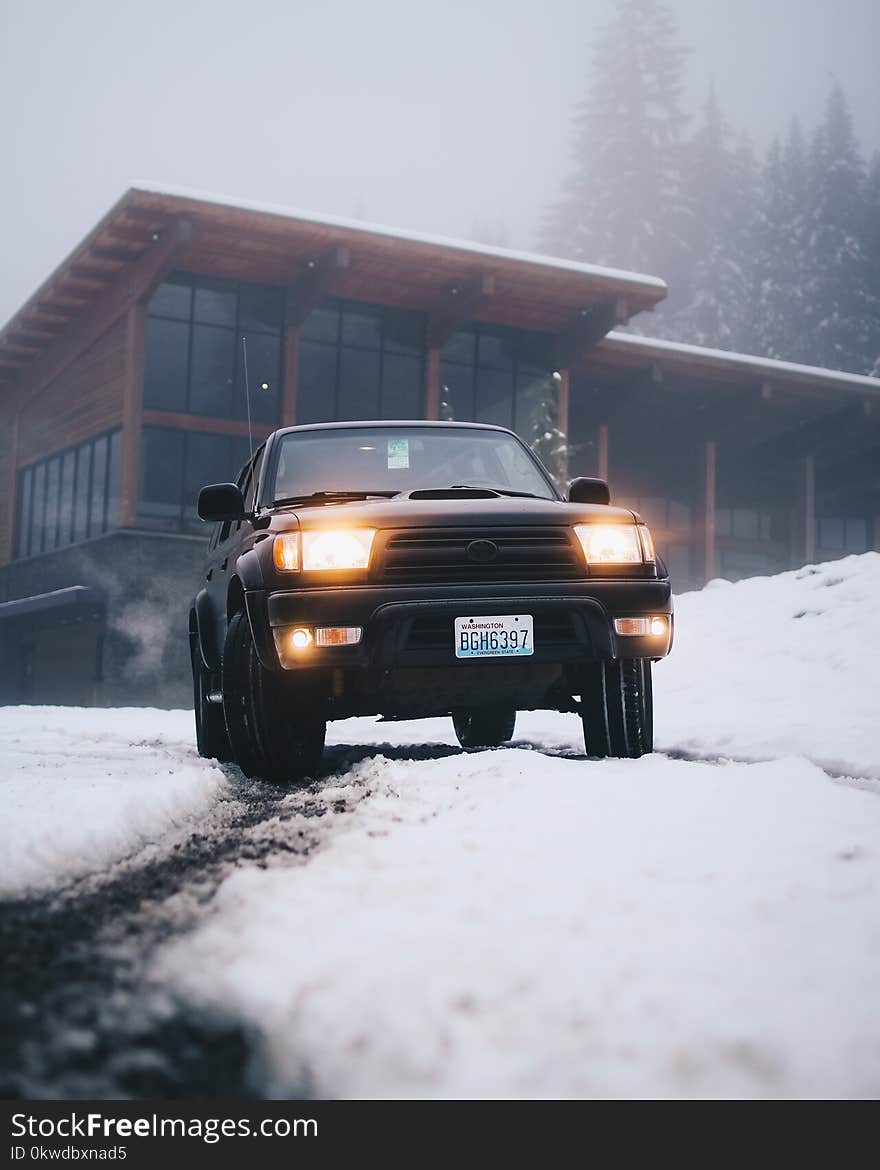 Black Toyota Vehicle on Snow Field at Daytime