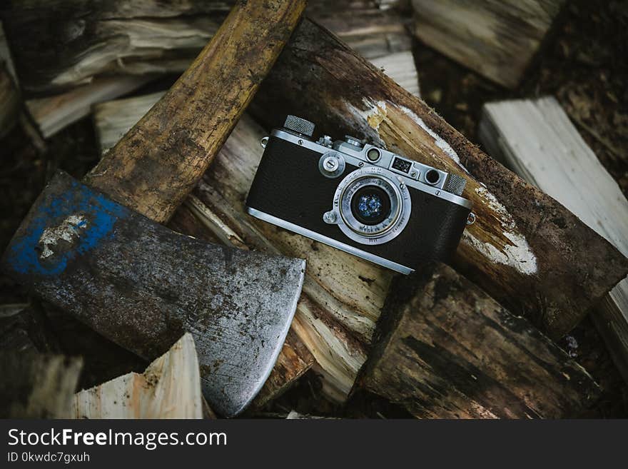 Black And Grey Camera Near Ax