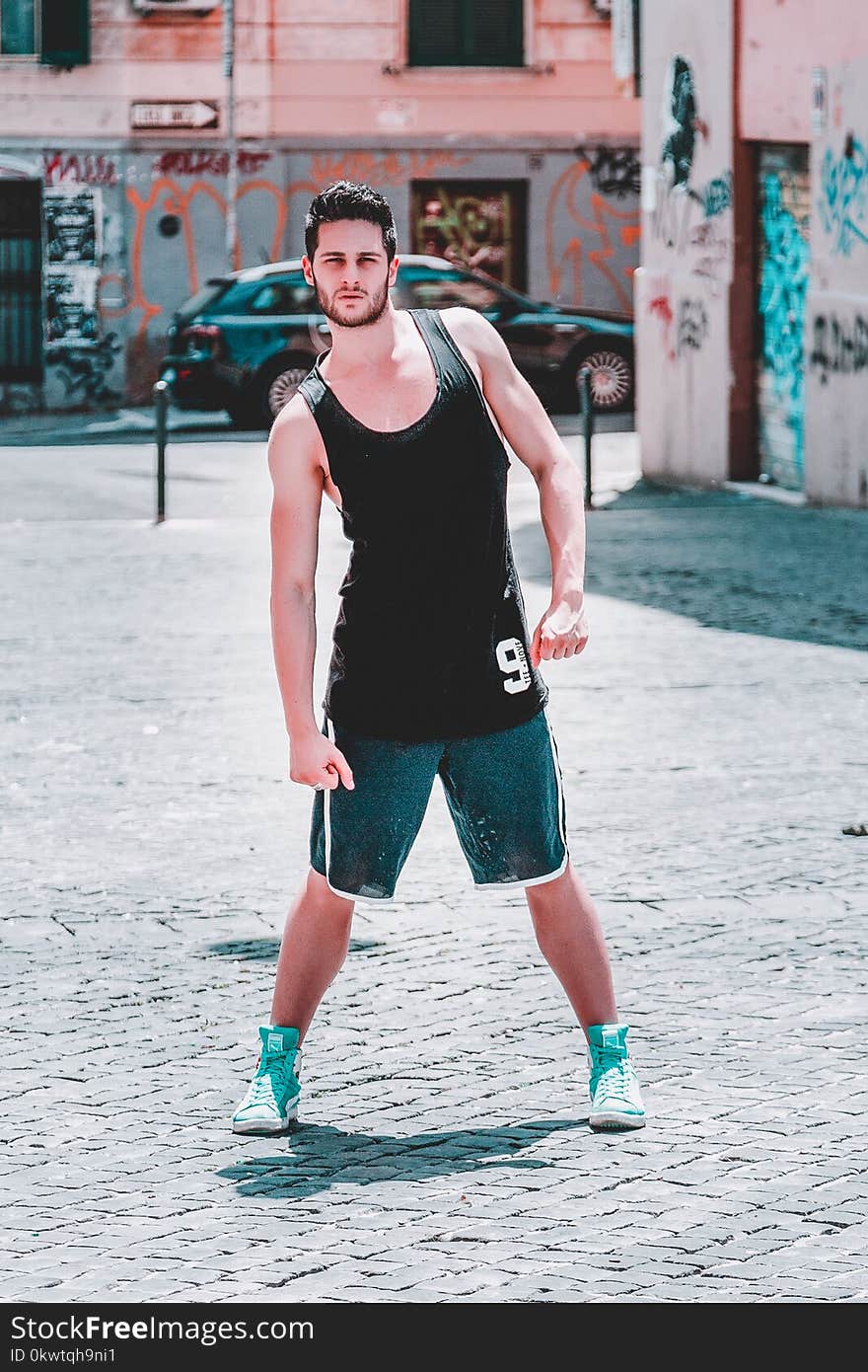 Man Wearing Black Tank Top