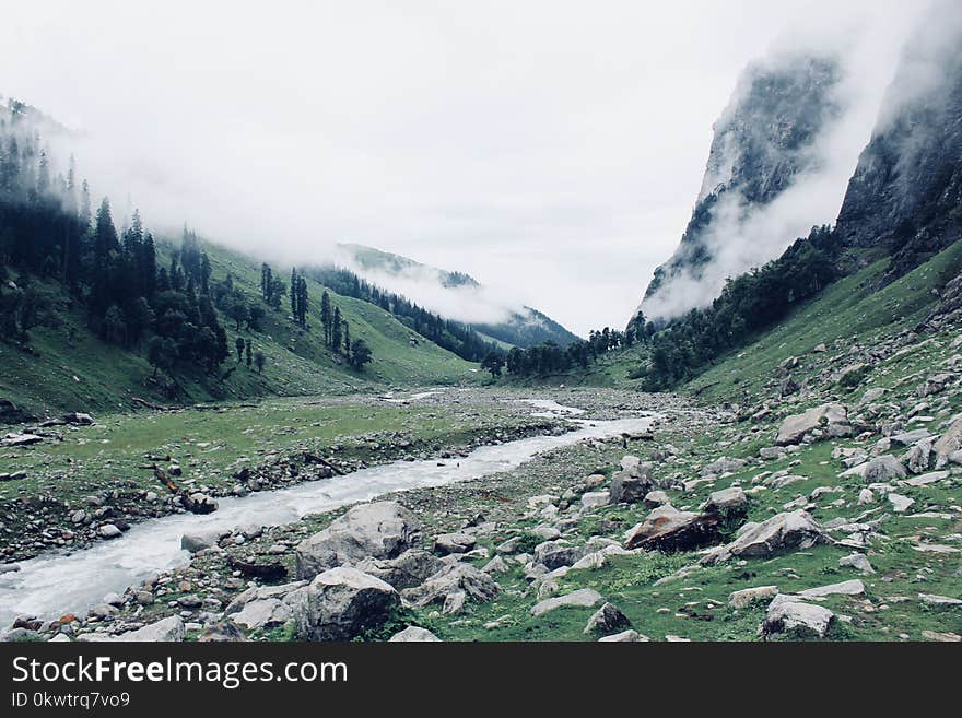 River Between Mountains With Fogs