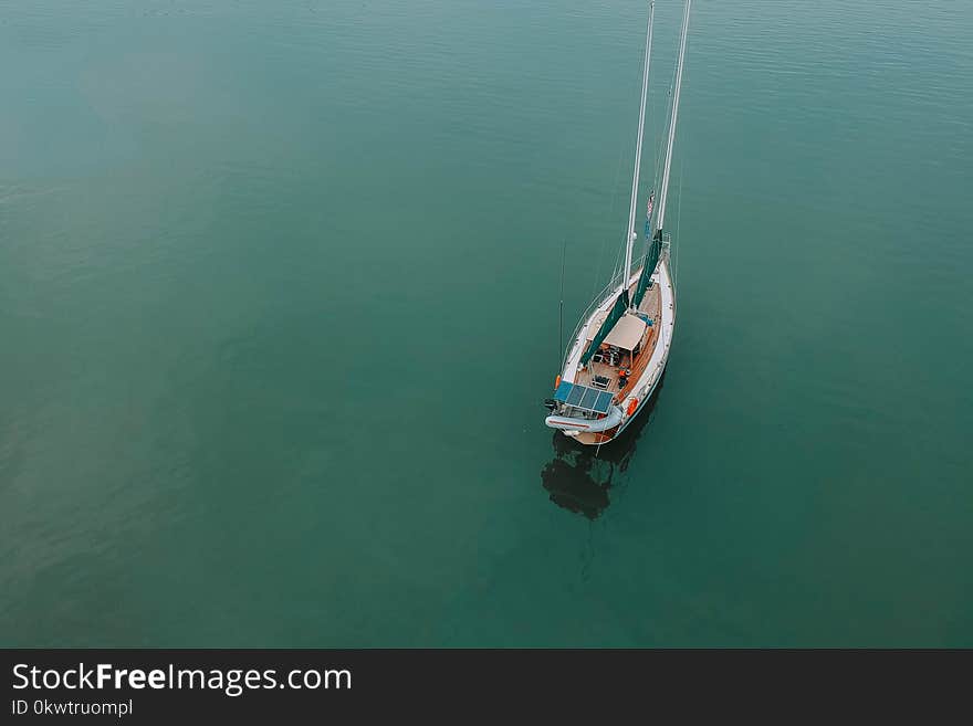 Aerial Photography Of Boat On Body Of Water