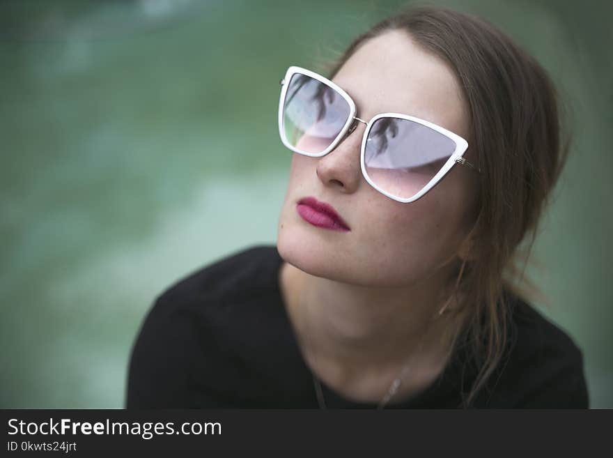 Woman Wearing Gray Framed Butterfly Sunglasses