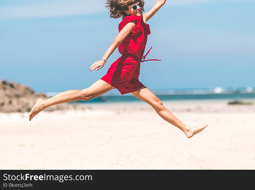 Woman In Red Jumping