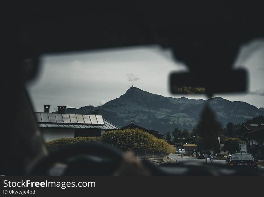 Person Sitting on Car Seat Viewing Mountain