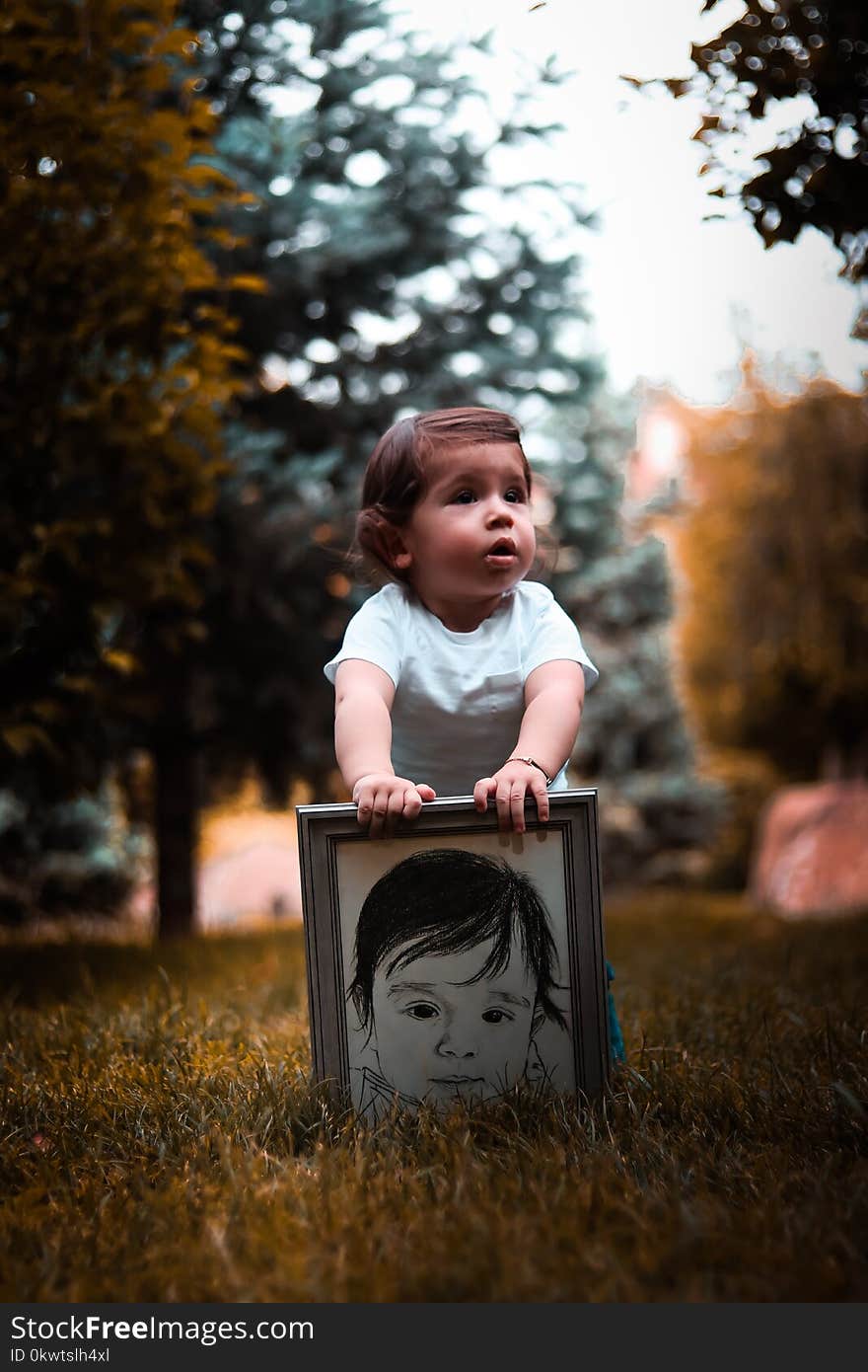 Girl Wearing White Shirt Holding Photo Frame