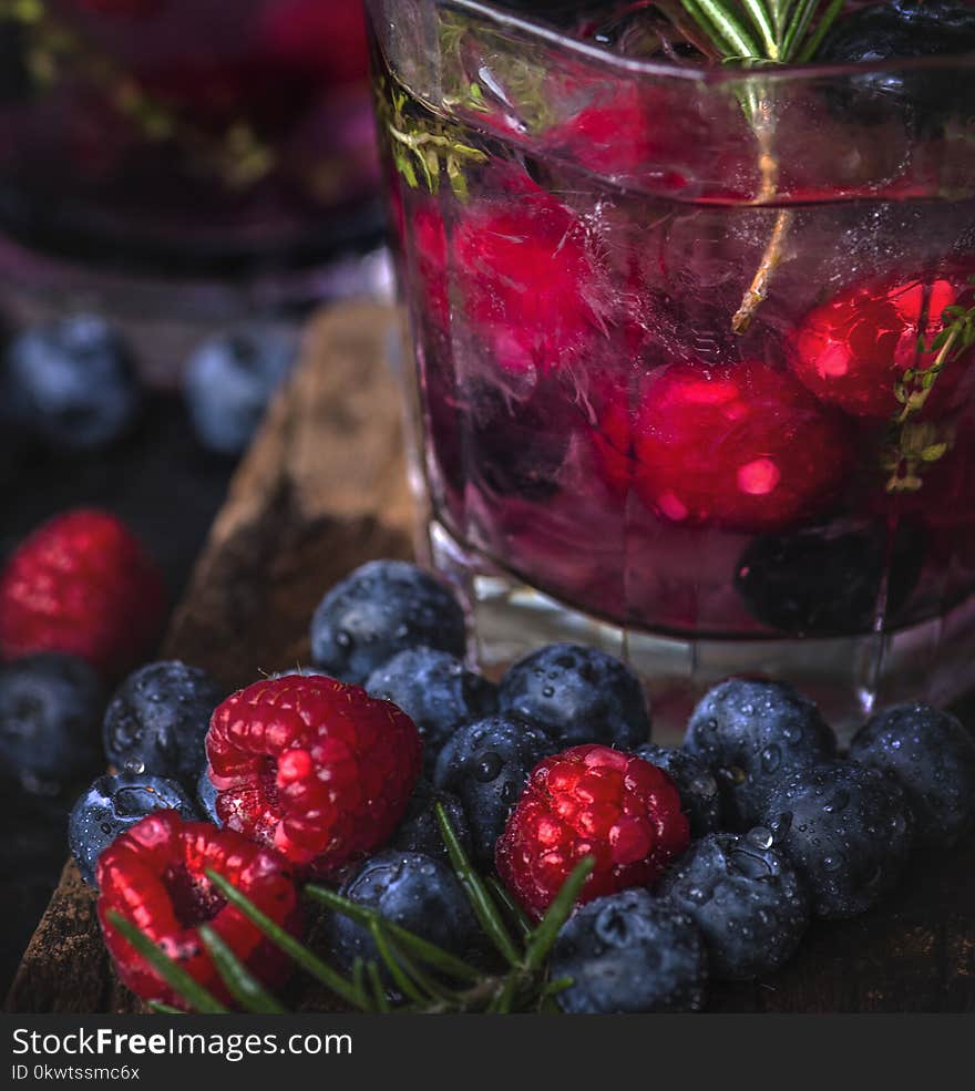 Closeup Photo of Blueberries Near Clear Drinking Glass