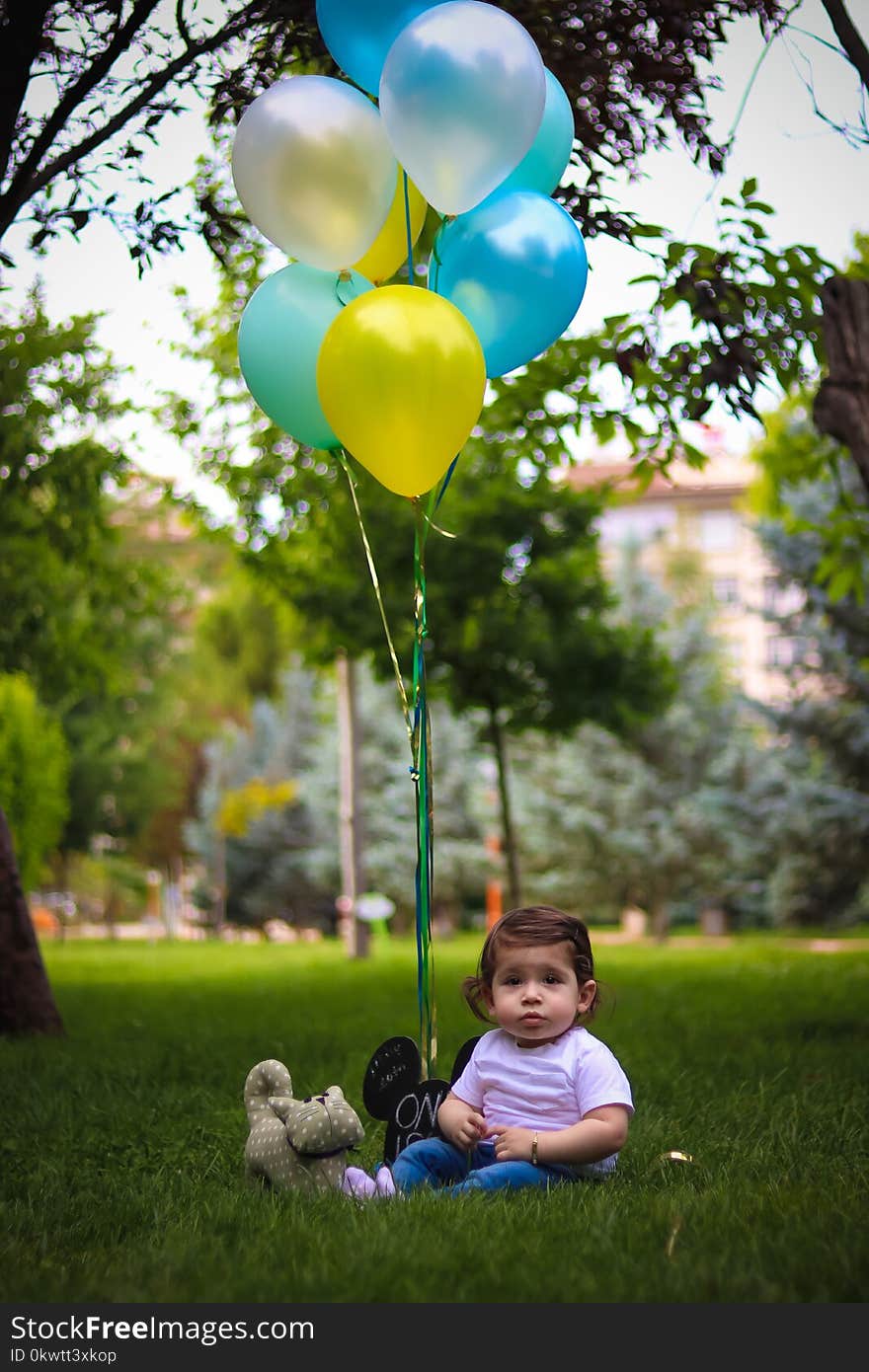 Baby&#x27; With Blue and Yellow Balloons