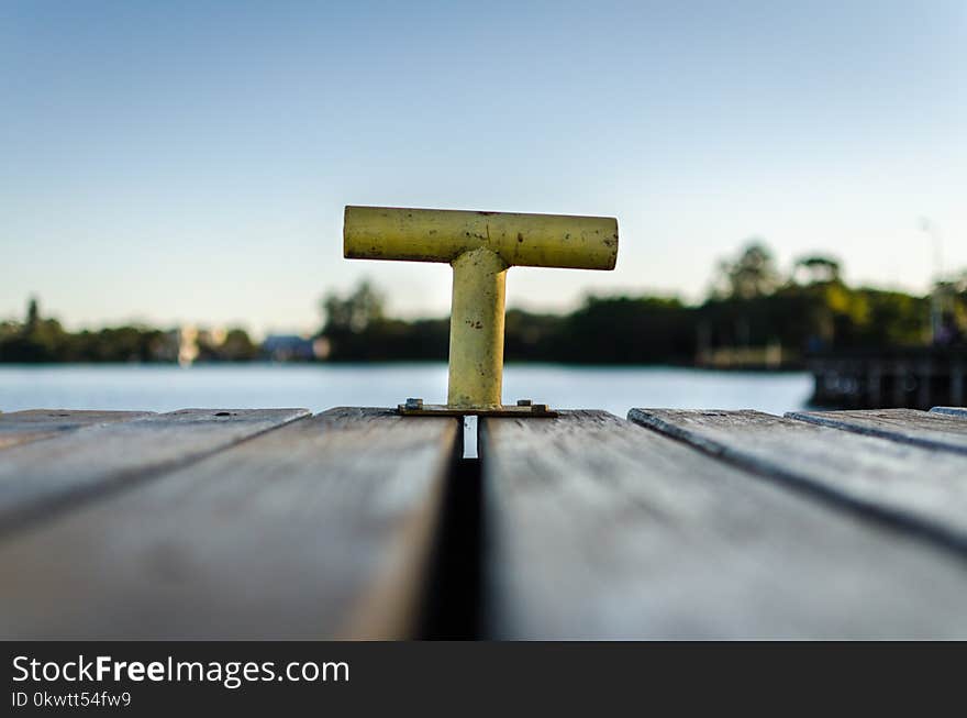 Selective Focus Photo of Yellow Bollard