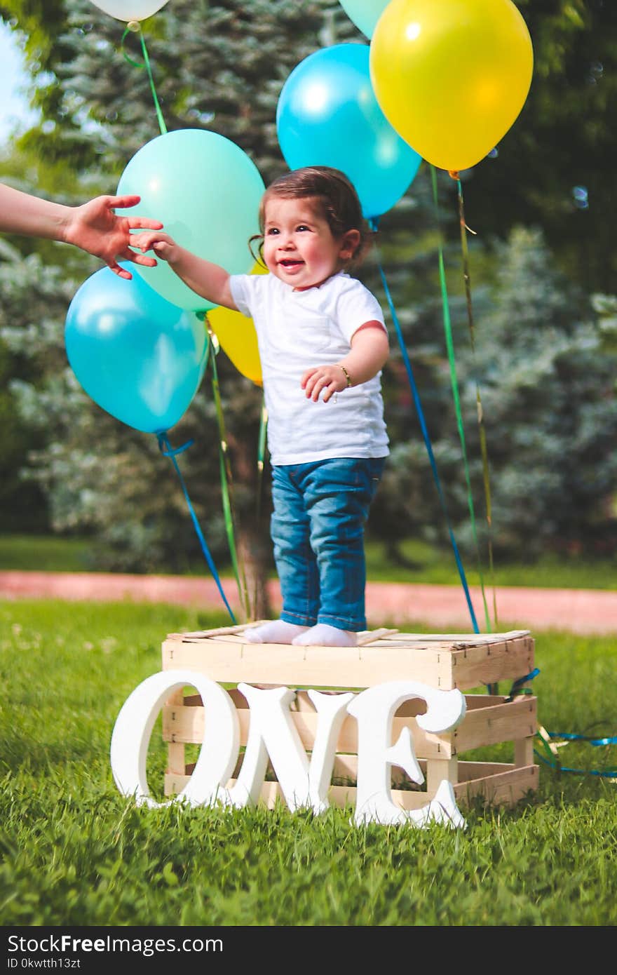 Toddler Standing on Wooden Crate