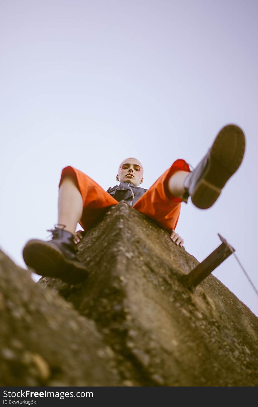 Man Sitting on Corner